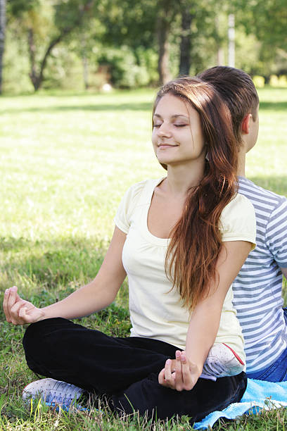 istock Contented woman relaxing in yoga pose 118946914