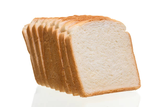 istock Fresh homemade  baked bread and sliced bread isoalted on  white 1189469987