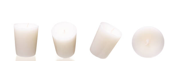 istock White candle on white background isolated. Set of wax candle. 1189469993