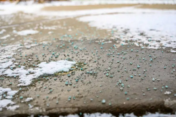 close focused low angle view of salt, ice, and snow