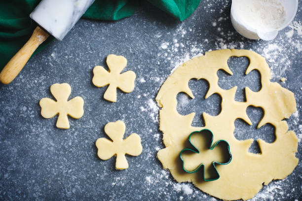 Baking St. Patrick's Day cookies. Baking St. Patrick's Day cookies. good luck charm photos stock pictures, royalty-free photos & images