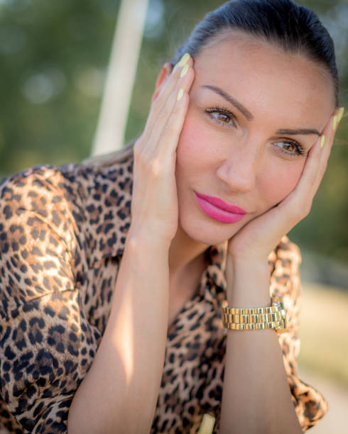 Portrait of an attractive young woman while relaxing outdoors