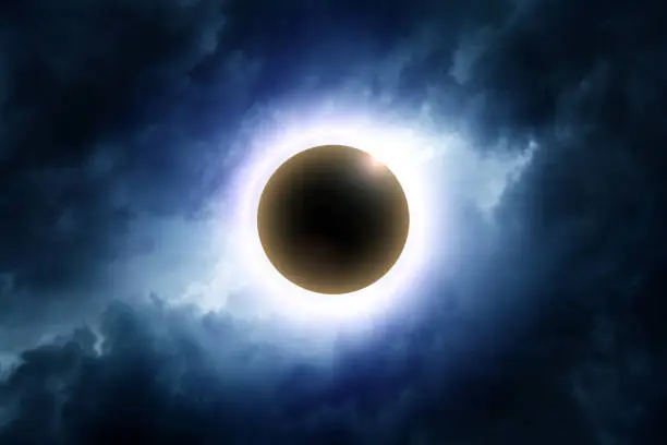 Eclipse of the Sun in the Abstract Dark Storm Clouds