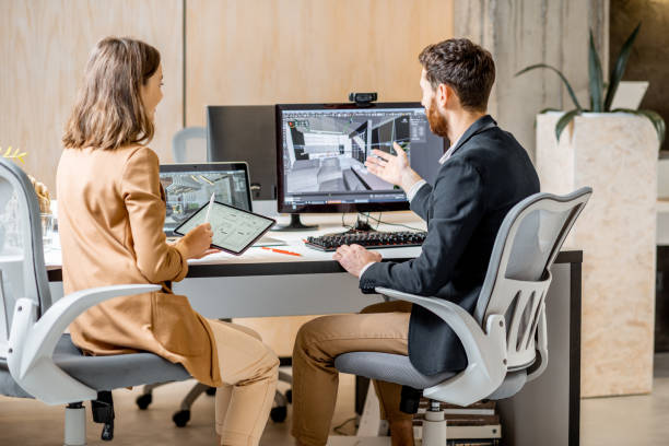 istock Two interior designers working in the office 1189488000