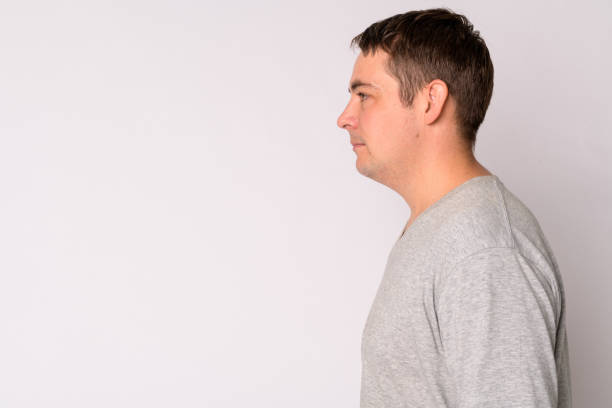 istock Profile view of handsome man against white background 1189488144