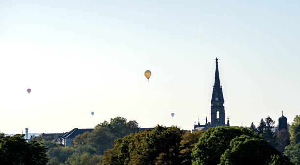 Colorful hot air balloons flying over champagne Vineyards at Montagne De Reims, France