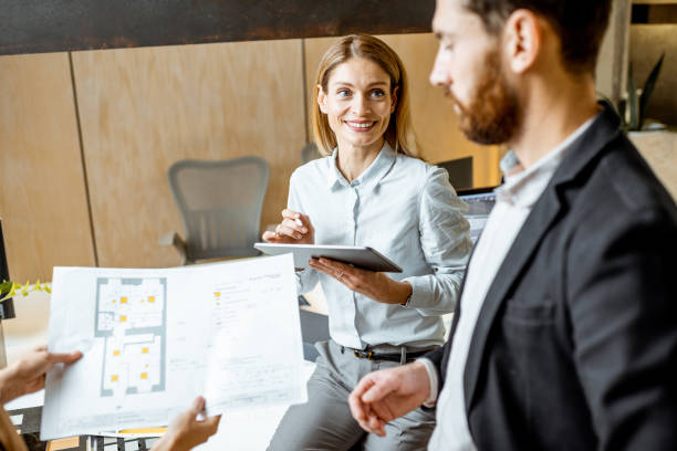 istock Colleagues working on architectural project in the office 1189488303