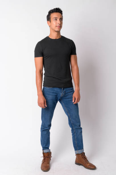 istock Full body shot of handsome Hispanic man thinking 1189488441