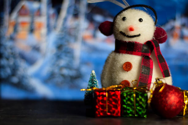 istock Close up decoration snowman and christmas tree isolated on bokeh background 1189488471