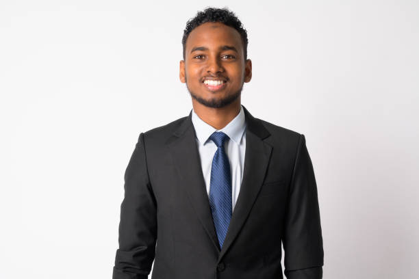 istock Happy young handsome African businessman in suit smiling 1189488659