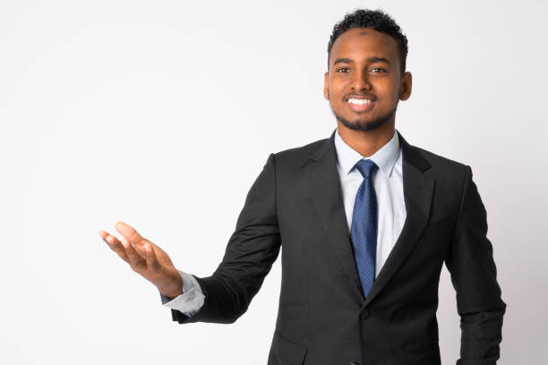 istock Happy young handsome African businessman showing something 1189488676