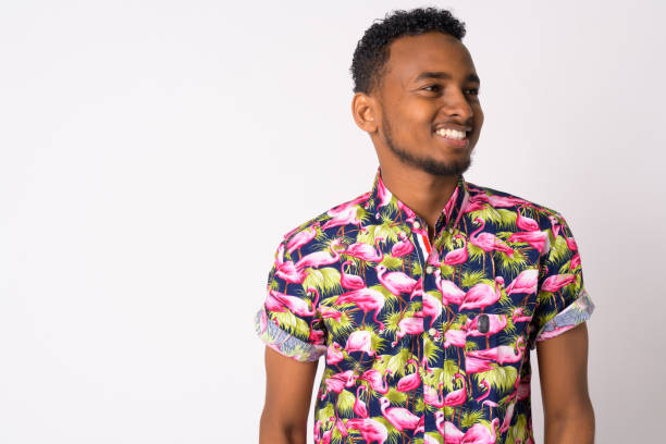 istock Happy young handsome African tourist man thinking 1189489274