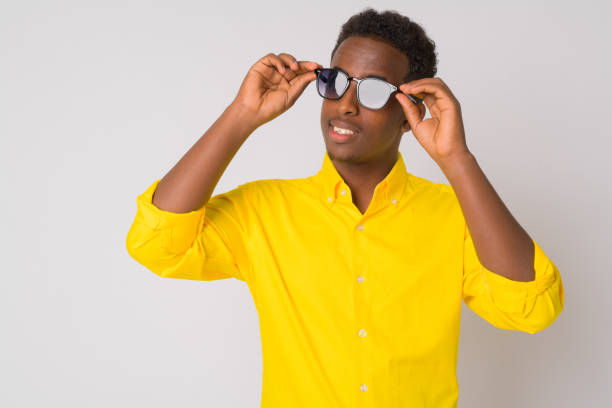 istock Happy young African businessman thinking with sunglasses 1189489708