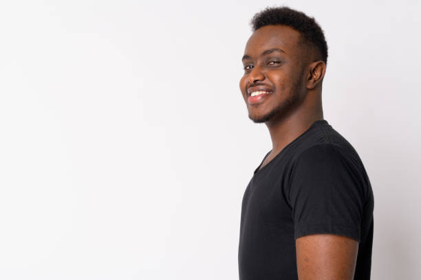 istock Profile view of happy young African man looking at camera 1189489939