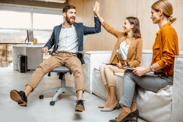 istock Playful employees having fun in the office 1189489961