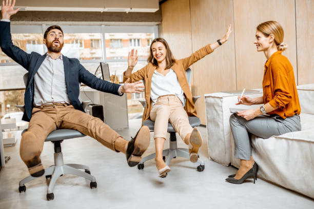 istock Playful employees having fun in the office 1189489963