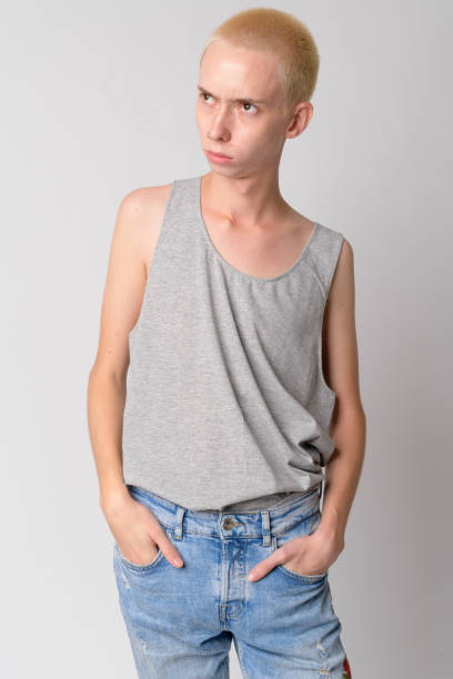istock Portrait of young handsome androgynous man thinking 1189490782