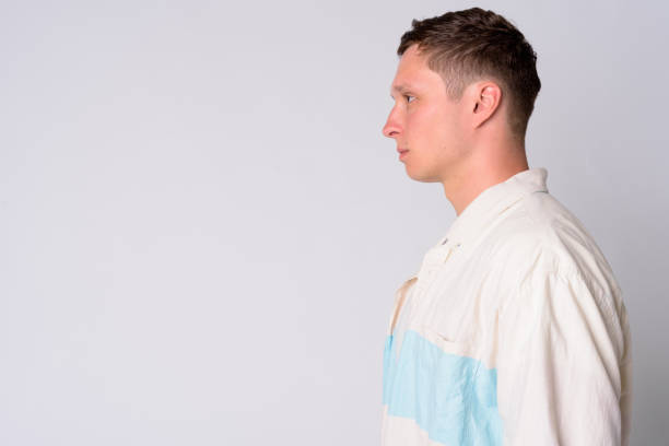 istock Profile view of young man against white background 1189492308