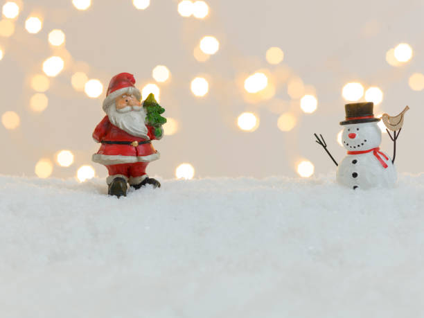 istock christmas items on white snow with many small, shining lights in the background 1189494247