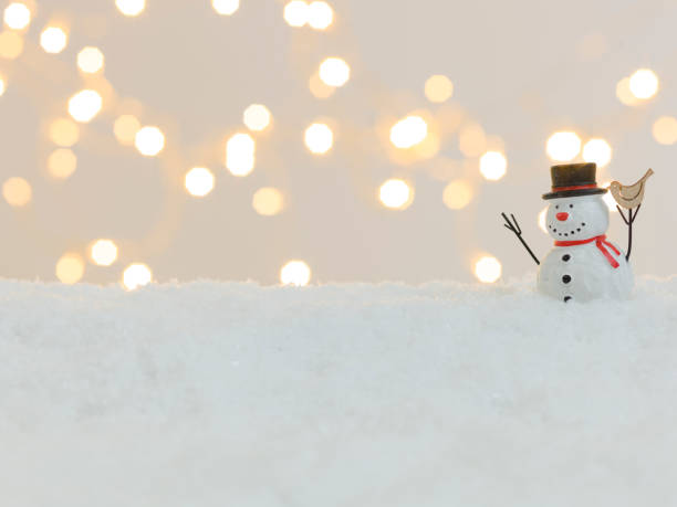 istock christmas items on white snow with many small, shining lights in the background 1189494433