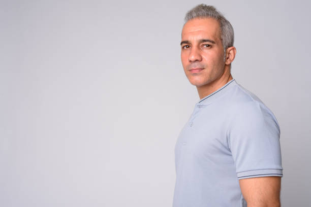 Studio shot of handsome Persian man against white background