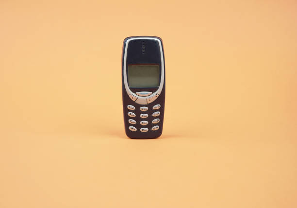 Vintage Old telephone orange background stock photo