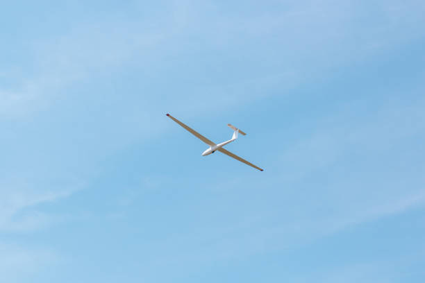 istock Small glider flying against the pink sky 1189496311