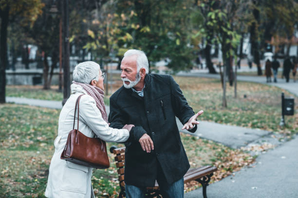 istock Mature Couple Having a Debate in the Public Park 1189499078