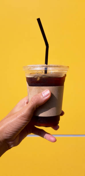 istock hand holding a Coffee cup,watering  in cup 1189499252