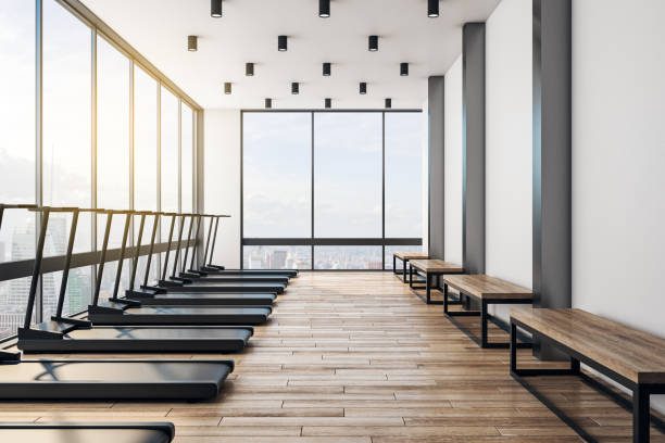 istock Modern light gym interior with wooden floor 1189505781