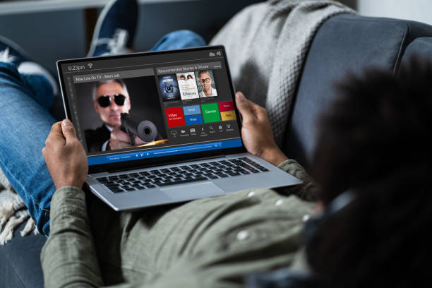 istock Man Watching Thriller Movie On Laptop 1189507311