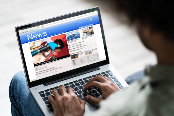 istock Man Watching Online News On Laptop 1189508172