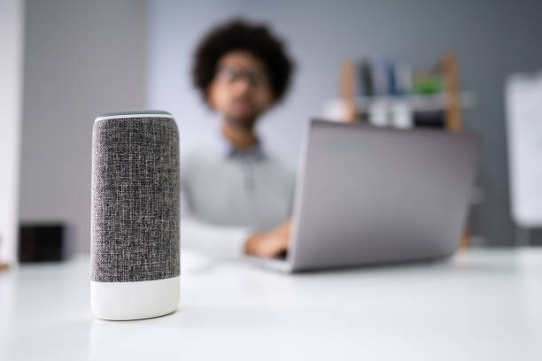 istock Man Listening To Music On Wireless Speaker 1189508276