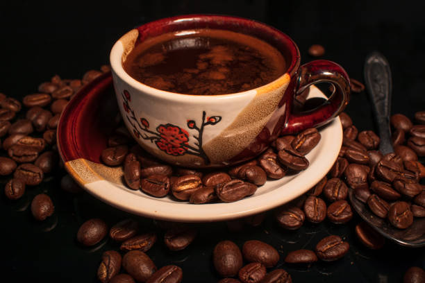istock Small cup of coffee and coffee beans 1189508405
