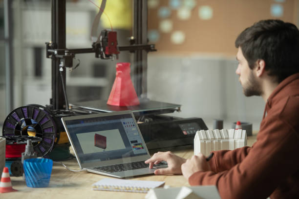 istock Young creative engineer or designer working over picture of new 3d model 1189510269