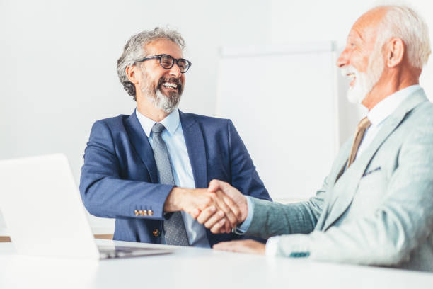istock Businessmen shaking hands 1189511695