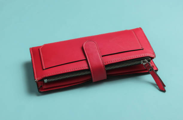 istock Red leather wallet on blue background. 1189514553