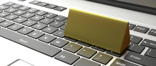 istock Table tent, reserved card sign empty blank on a laptop. 3d illustration 1189518896