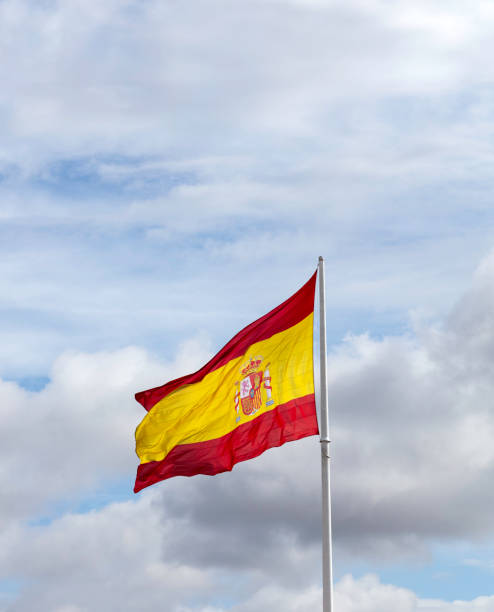 istock spanish flag waving in the wind 1189521051