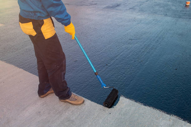 worker applies bitumen mastic on the foundation - rubber imagens e fotografias de stock