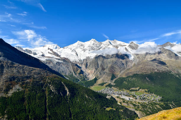 istock Mountain panorama with ski resort Saas Fee in valley. 1189525323