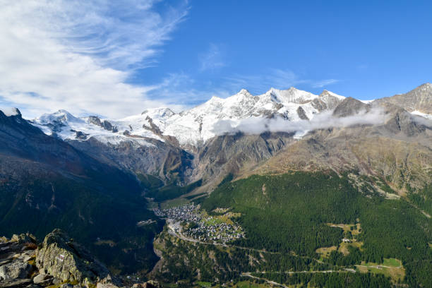 istock Mountain panorama with ski resort Saas Fee in valley. 1189525415
