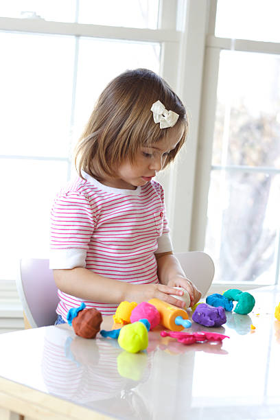 istock Girl playing with play dough 118952785