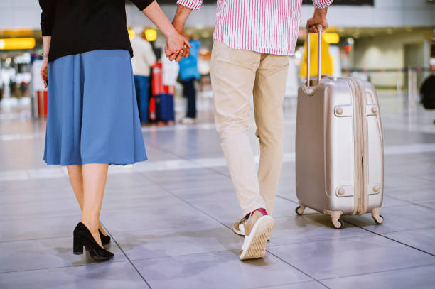 istock Young couple with a suitcase ready for travel 1189531619