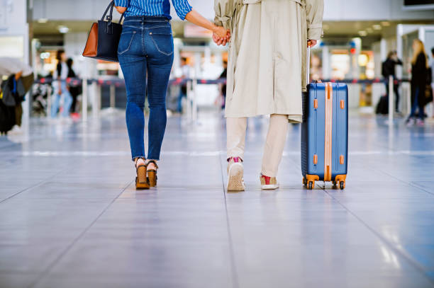 istock Young couple with a suitcase ready for travel 1189531656