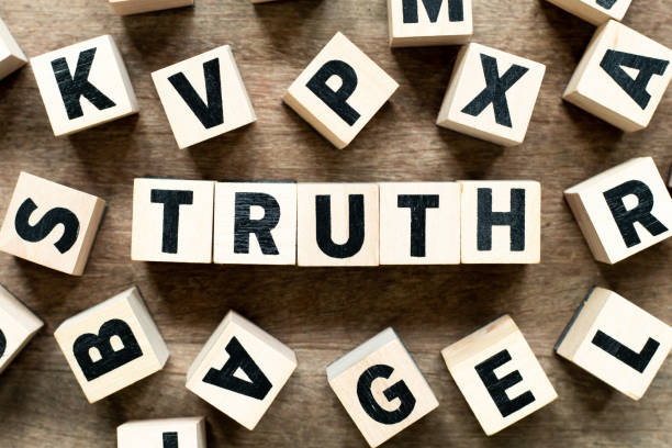 istock Letter block with word truth on wood background with another alphabet as frame 1189533807