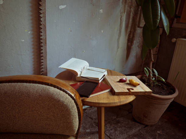 Chair and Old metal watering can in garden