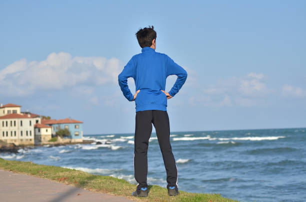 young man running to the sea
