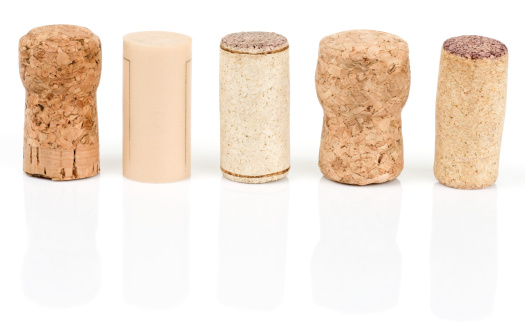 Various types of wine corks isolated on white