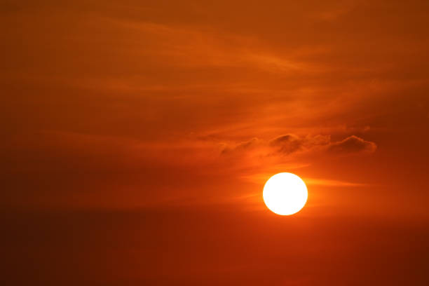 istock sunset on dark red orange sky back soft evening cloud over space 1189534778